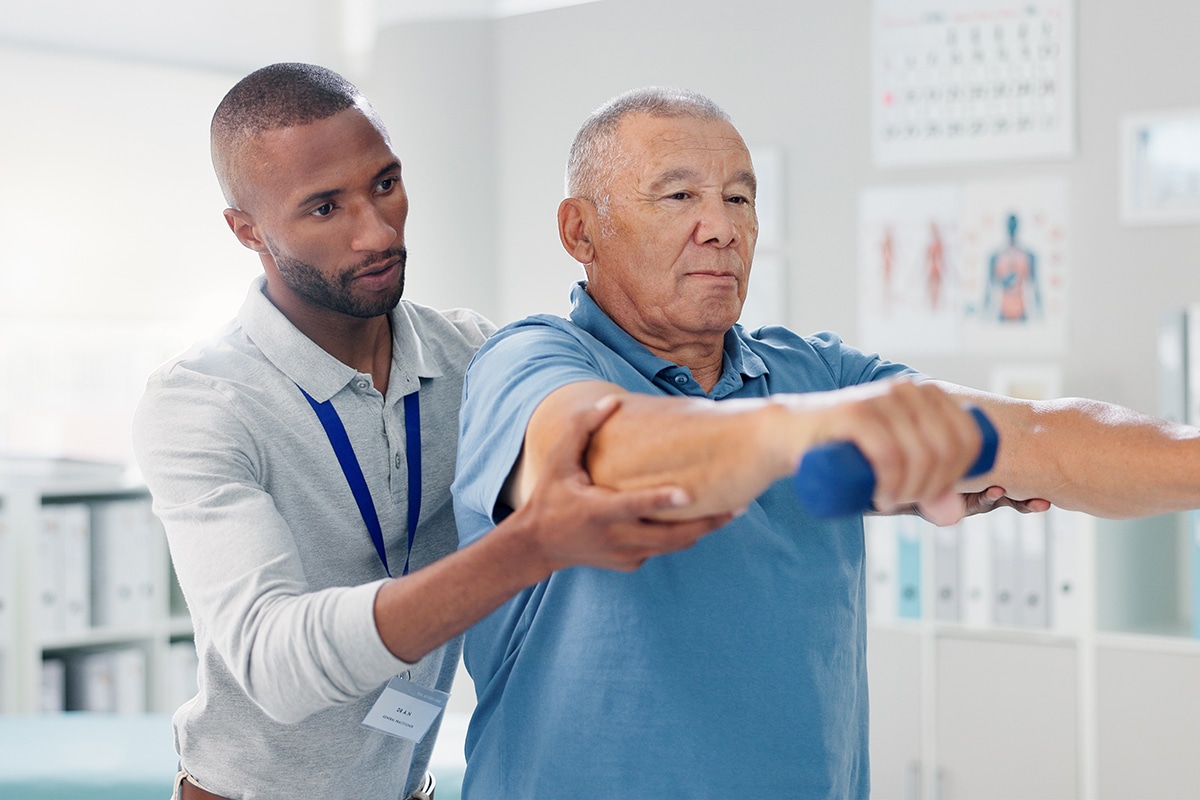 PACS-300x200-hands1 Dumbbells, physical therapy and old man with physiotherapist, muscle training and strength with senior care. Health, wellness and men at physio clinic for weightlifting, rehabilitation and equipment.